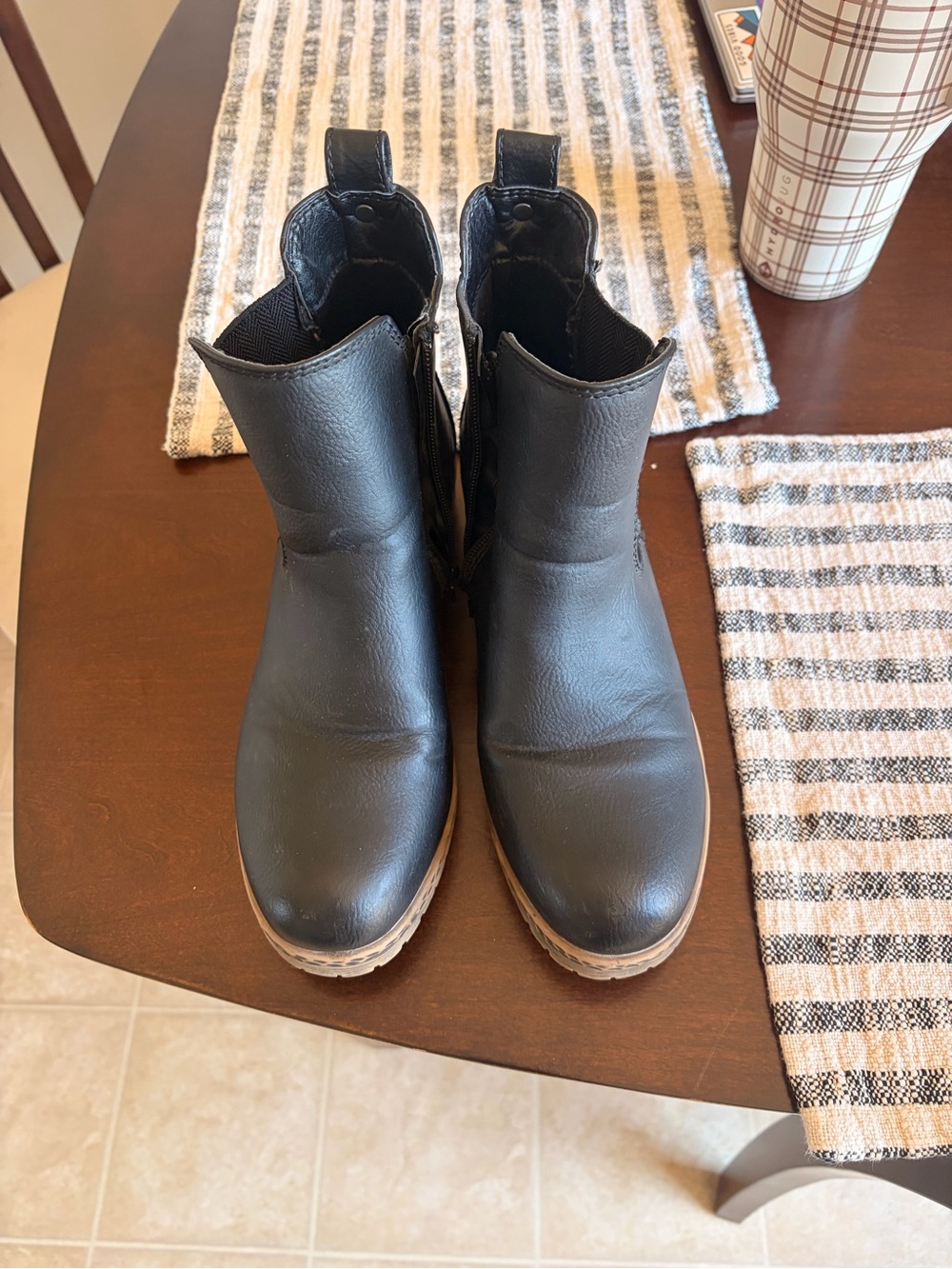 Maurice’s black leather Chelsea boots